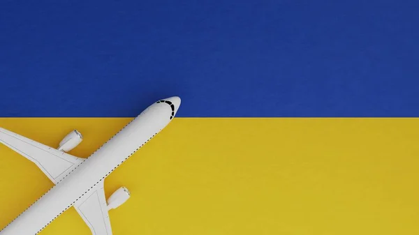 Top Down View of a Plane in the Corner on Top of the Country Flag of Ukraine