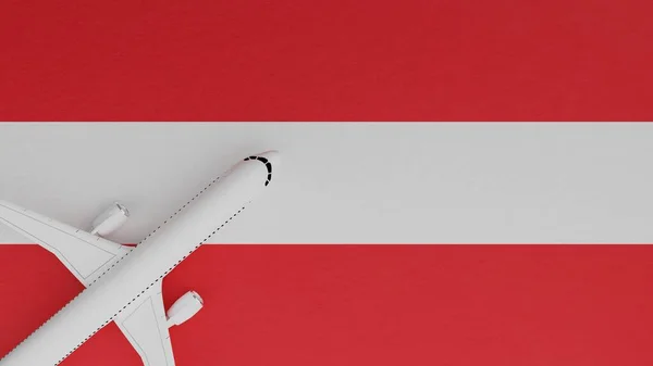 Top Down View of a Plane in the Corner on Top of the Country Flag of Austria