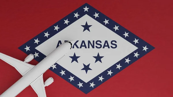 Top Down View of a Plane in the Corner on Top of the US State Flag of Arkansas