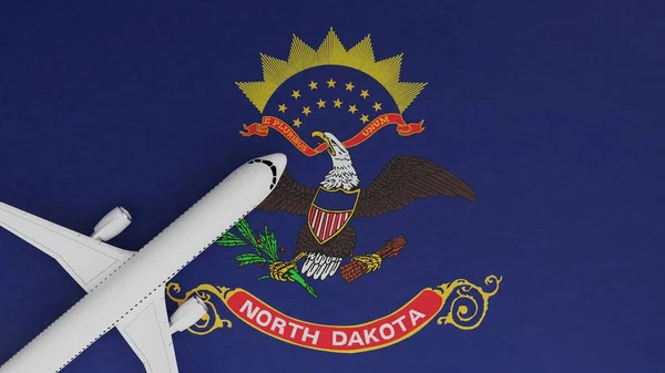 Top Down View of a Plane in the Corner on Top of the US State Flag of North Dakota