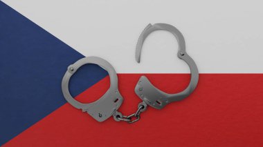 Yarı açık çelik kelepçe ortada ve Çek Cumhuriyeti bayrağının tepesinde