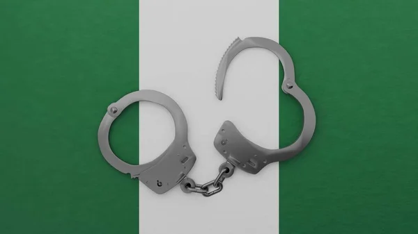 Polorozepnuté Ocelové Pouta Uprostřed Vrcholu Národní Vlajky Nigérie — Stock fotografie