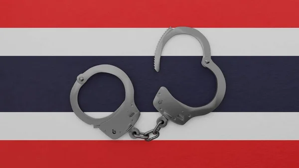 タイ国旗の中央と上部にスチール製の手錠を半開き — ストック写真