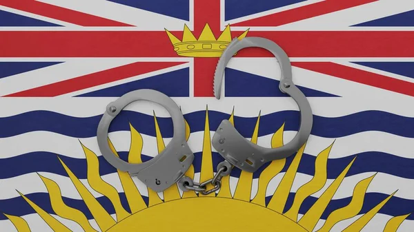 Half opened steel handcuff in center and on top of the flag of British Columbia
