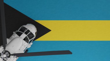 Bahamalar 'ın ulusal bayrağının tepesinde, sol alt köşedeki beyaz helikopterin yukarıdan görünüşü.