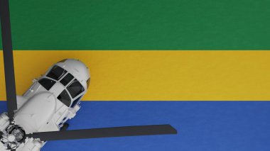 Sol alt köşede ve Gabon Ulusal Bayrağı 'nın tepesinde bir Beyaz Helikopter görünüyor.