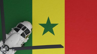 Sol alt köşede ve Senegal Ulusal Bayrağı 'nın tepesinde beyaz bir helikopter görünüyor.