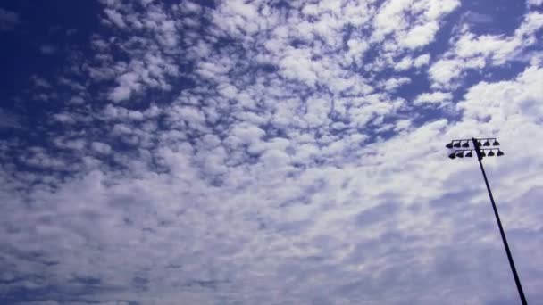 Nuvens que passam sobre um campo de futebol — Vídeo de Stock