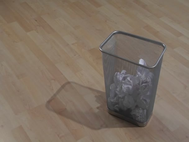 Pieces of waste paper are thrown into a garbage can — Stock Video