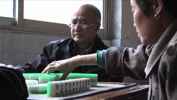 Chinese citizens play Mah Jong to pass the time — Stock Video