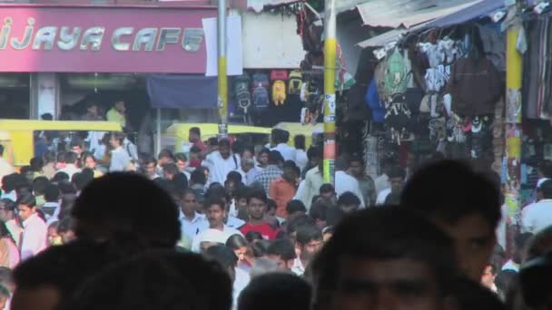 People are walking down an extremely crowded street — Stock Video