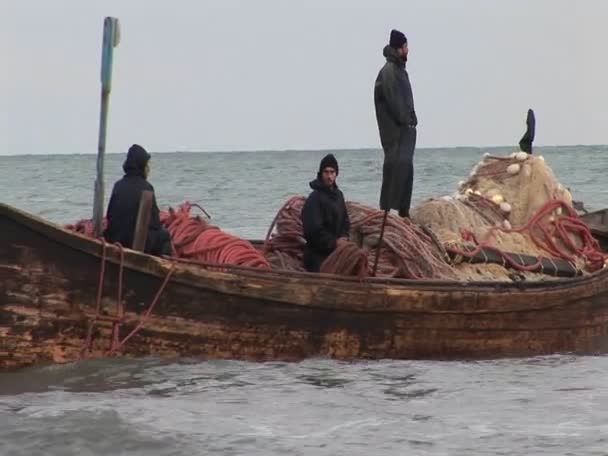 Fishermen pass on a traditional style boat — Stock Video
