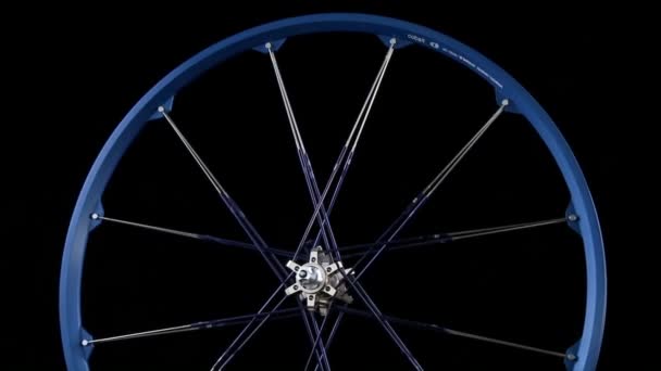 A blue wheel with spokes revolves. — Stock Video