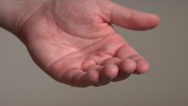 A man puts a gemstone ring on a woman's hand — Stock Video