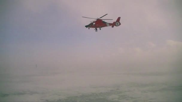 Coast Guard helicopter in a blizzard — Stock Video