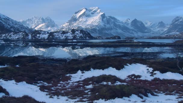 Snow covered shoreline amidst fjords north — Stock Video