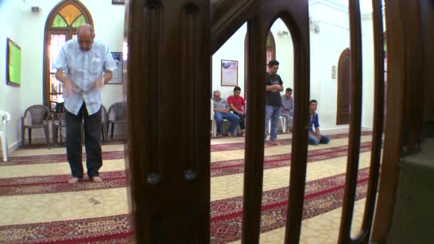 Muslims pray inside a mosque — Stock Video