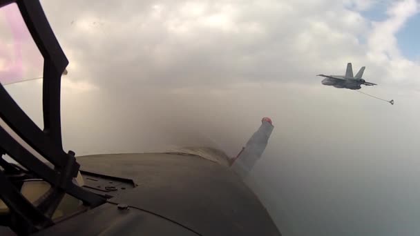 Jet fighter plane refueling in midair — Stock Video