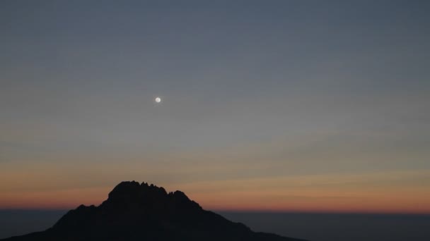 Moon over rocky outcrop — Stock Video