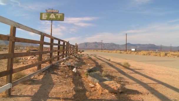 Abandoned diner with a sign reading eat — Stock Video