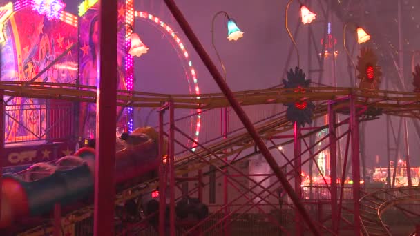 Roller coaster at an amusement park — Stock Video