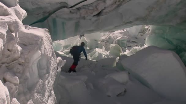 Climber walks under serac — Stock Video