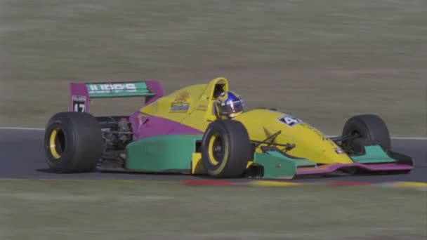 A racing car speeds down a track — Stock Video