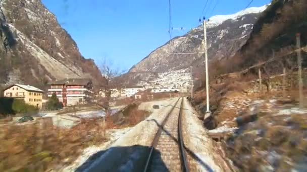 Train moving through a mountainous region — Stock Video