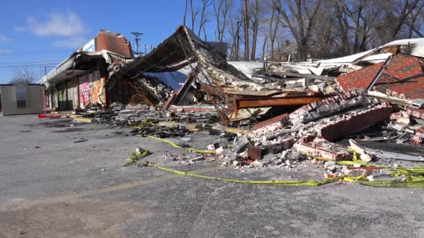 Buildings lie flattened burned — Stock Video