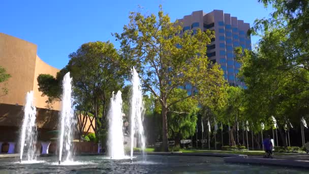 Fountains dance in front of office complex — Stock Video