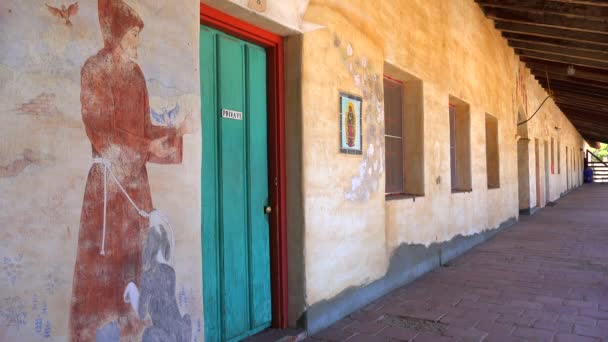 Murals line the walls of a California Mission — Stock Video