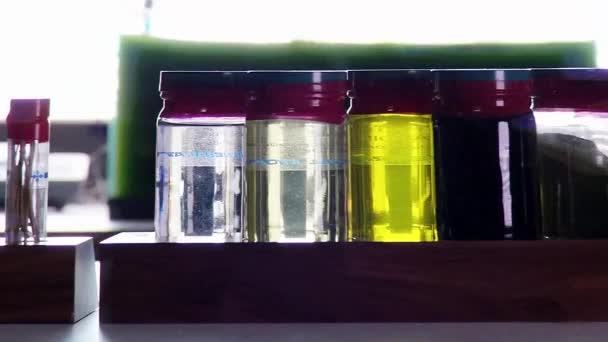 Samples of biofuel derived from algae — Stock Video