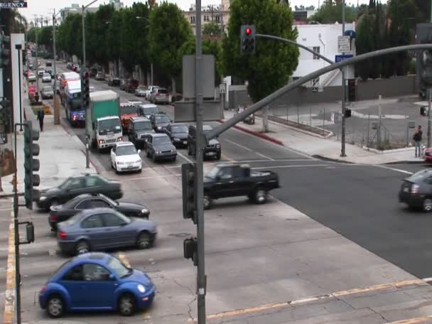 Traffic drives through a intersection — Stock Footage Traffic drives through a intersection Stock Footage