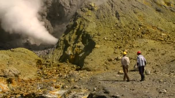 Steam rises from volcanic vents in a crater — Stock Video