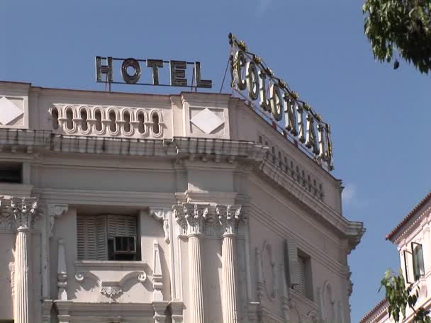 A sign at the top of a building — Stock Video