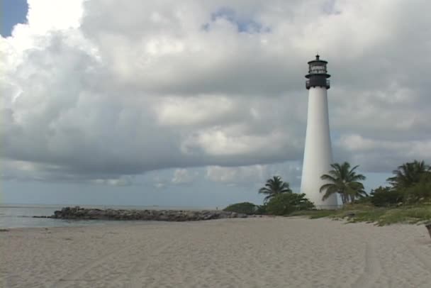 A lighthouse stands at the beach — Stock Video