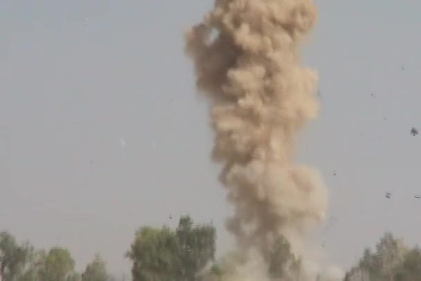 Explosion sends dirt and metal shards — Stock Video