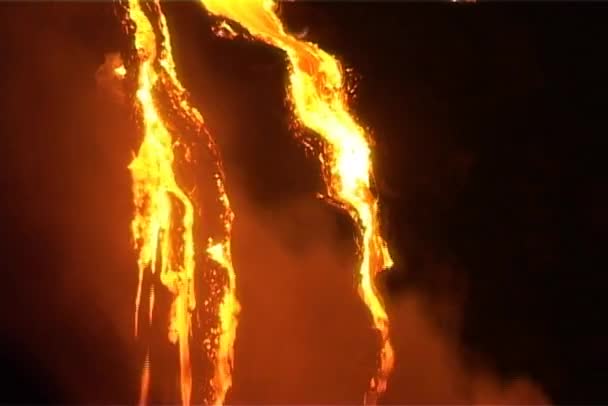 Lava trickles down a steep slope — Stock Video