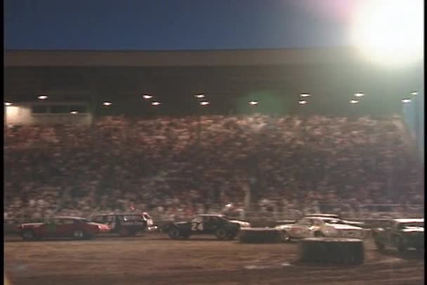 Demolition cars race around tires — Stock Video