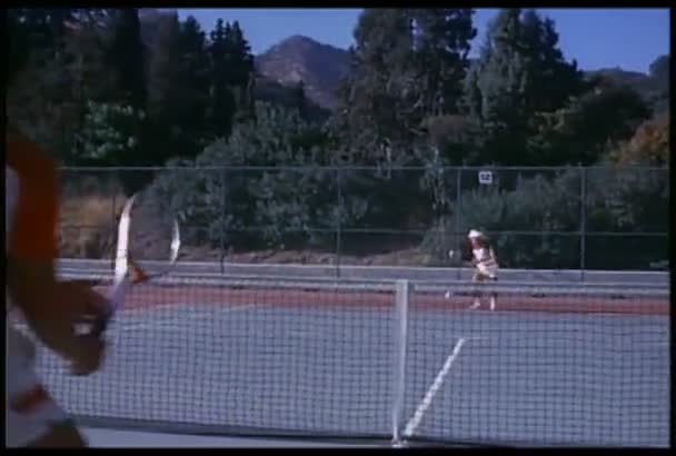 Shot of people playing tennis — Stock Video