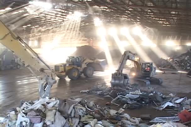 Tractors and shovels work in recycling center — Stock Video