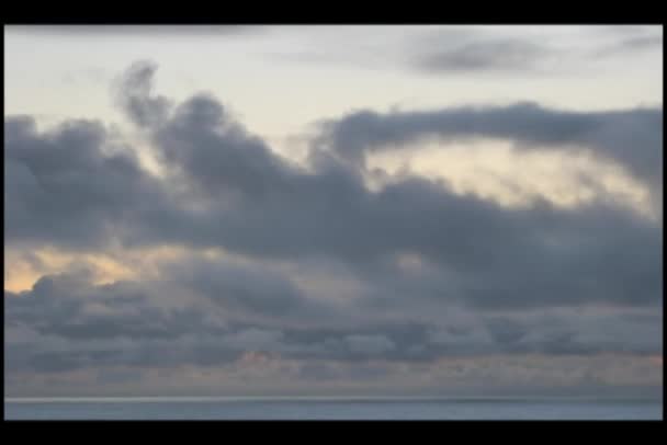 Moving clouds passing over water — Stock Video