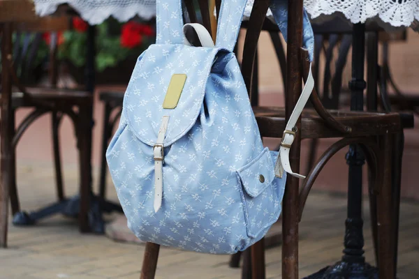 Backpack on the chair of cafe — Stock Photo, Image