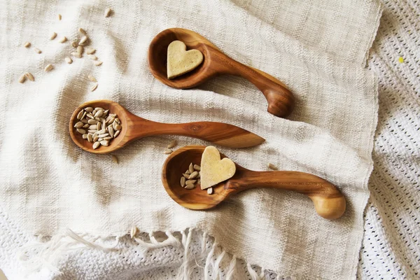 Wooden spoons hand on the table.