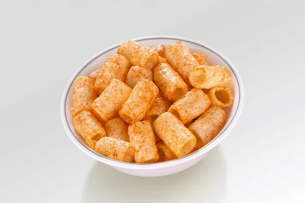 Crispy and Crunchy Salty Wheat Fryums pipe shaped, mini pipe, Corn Rings, Fried and Spicy Snack Food, White Bowl, Selective Focus - Image