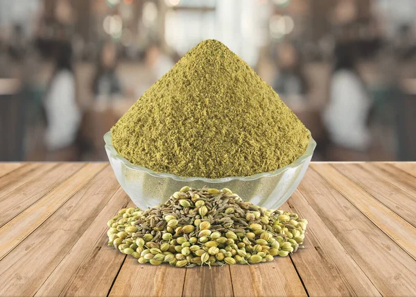 Coriander Powder (Dhaniya Powder) in a glass bowl with Coriander Seeds, Indian spices - Image.