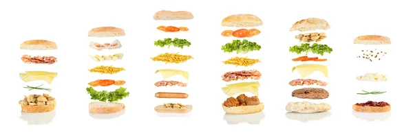 Six different sandwiches floating — Stock Photo, Image