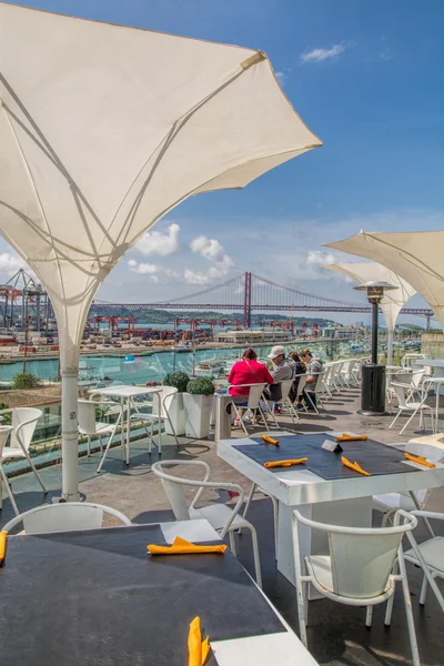 View of lisbon docks and bridge from a restaurant. — Stockfoto