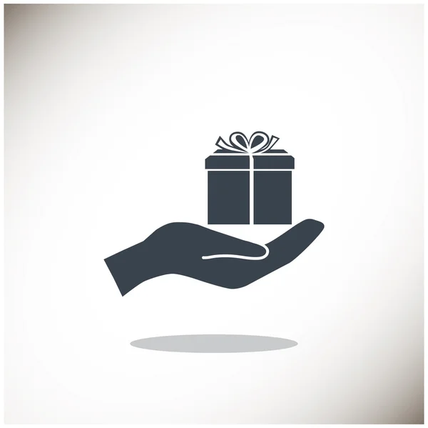 Gift box on hand web icon — Stock Vector