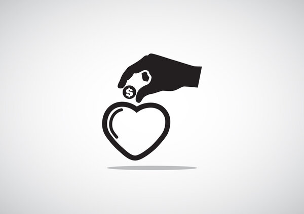 Бросание монеты в копилку в форме сердца
